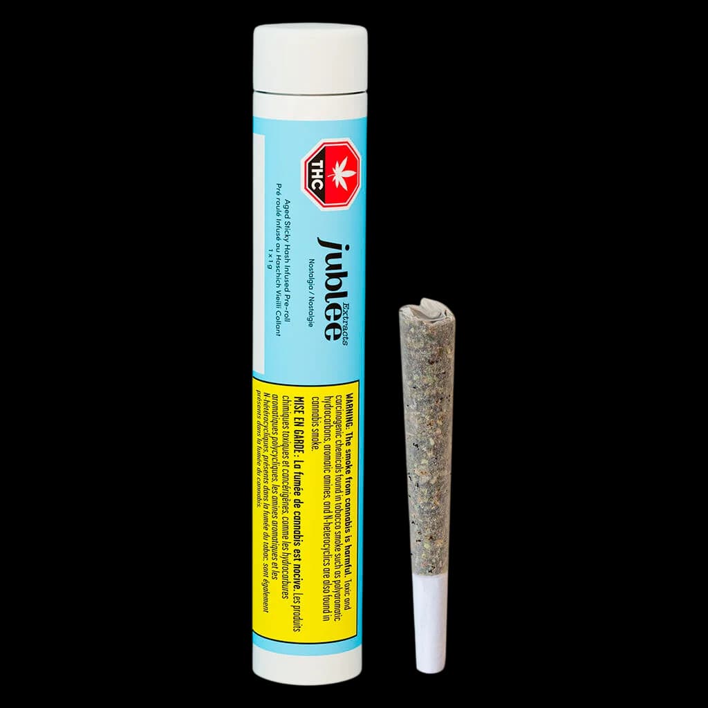 Pré-roulé infusé au haschich vieilli collant Nostalgia de Jubilee Extracts avec tube d'emballage affichant les détails du produit et les informations réglementaires