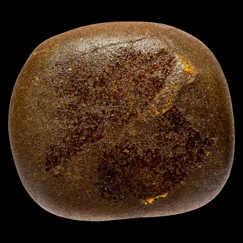 Bleuh Quebec Old School Hash, dark brown cannabis concentrate with granular texture