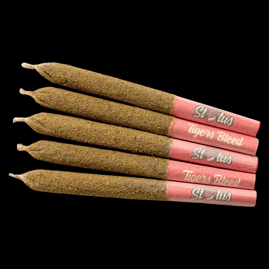 Five Status Tigers Bleed pre-rolls with pink paper and kief-coated cannabis flower