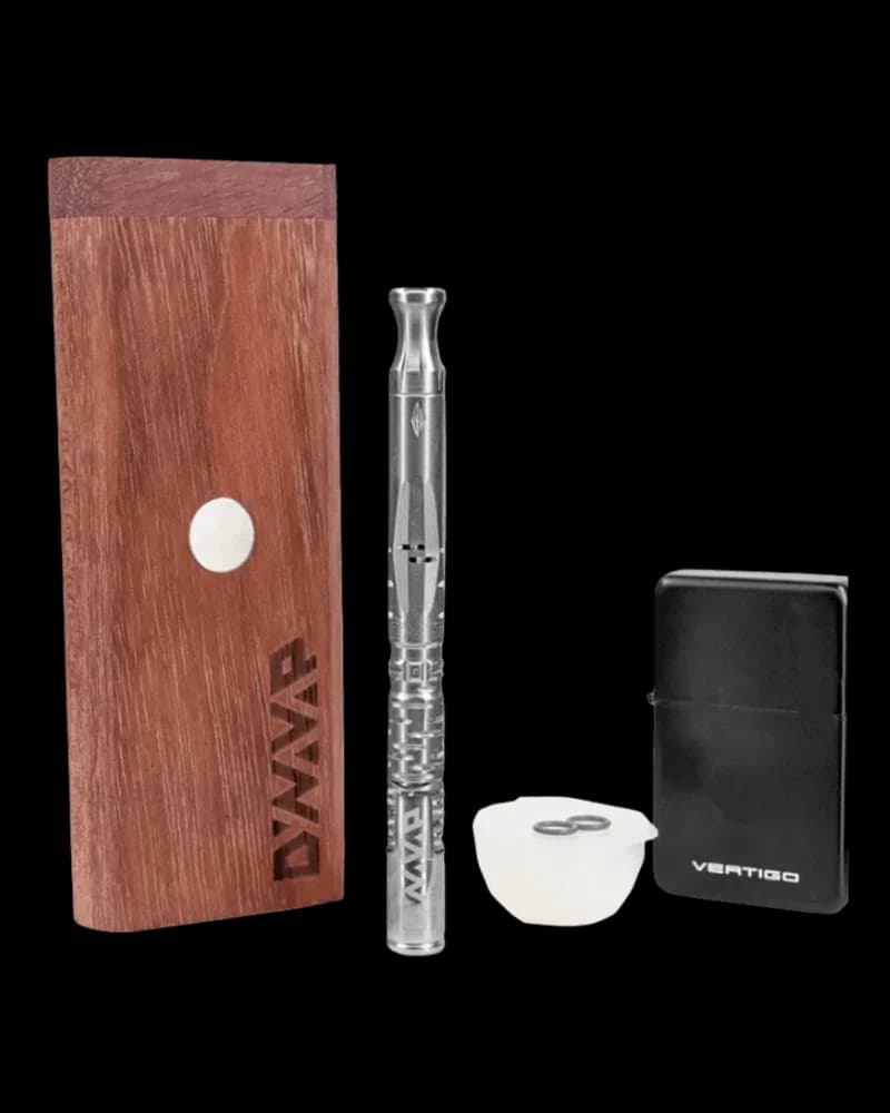 Dynavap Omni Starter Kit with wooden carrying case, metal vape device, ceramic bowl, and black storage container