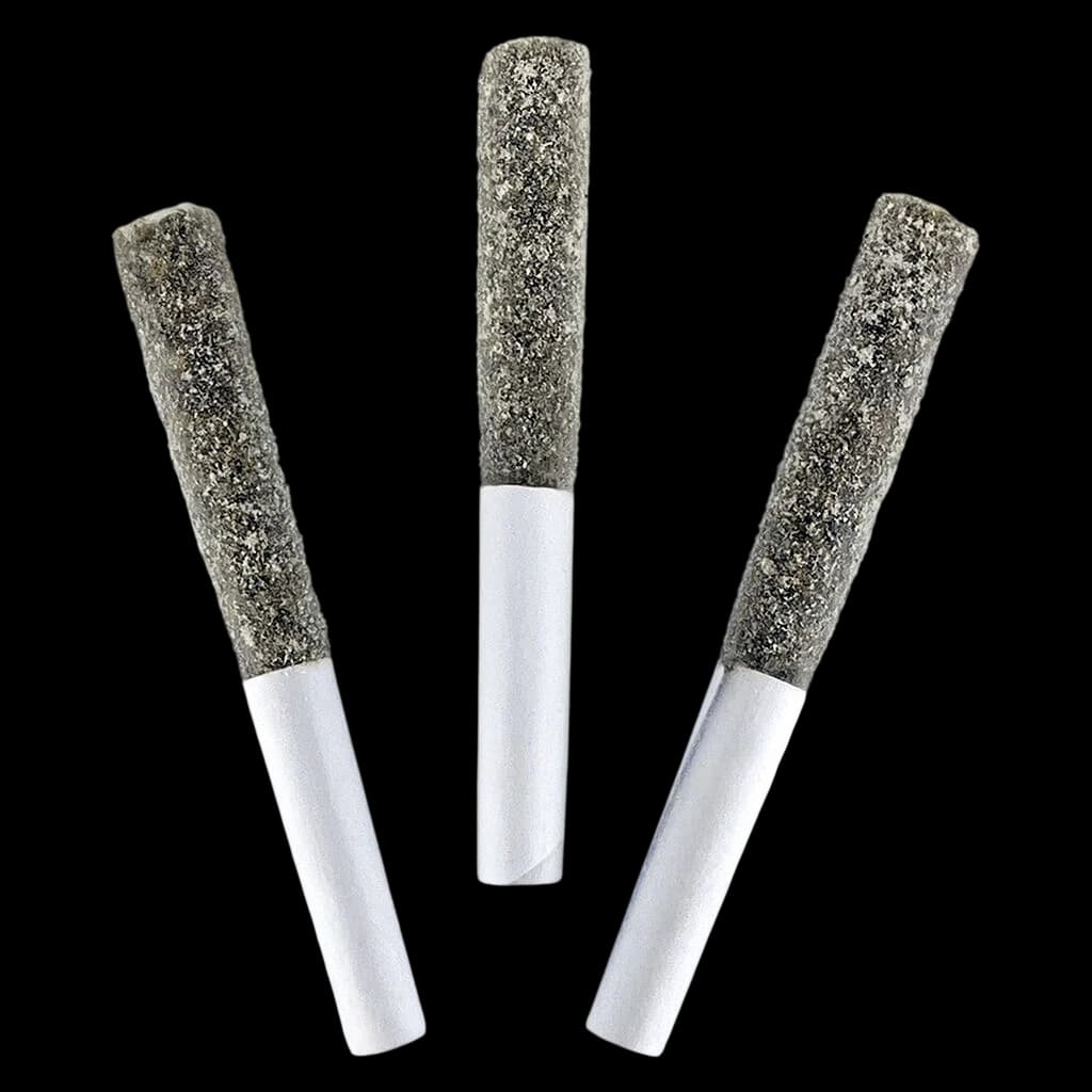 Three DEALR Infused Cherry Cola cannabis pre-rolls with white paper tubes and kief-coated tips