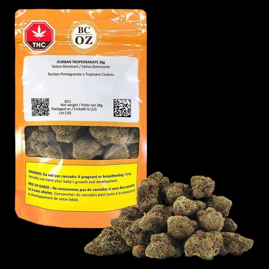 BC OZ Durban Tropegranate 28g cannabis dried flower with loose buds displayed in front of orange packaging