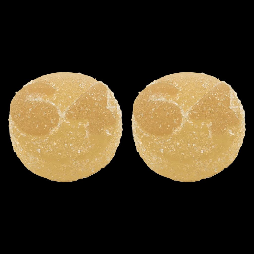 Deux gommes de cannabis jaune doré avec enrobage de sucre, gommes tendres 1964 THC:THC-V Orange Creams'cle Live Rosin