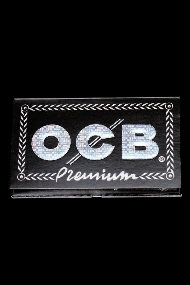 OCB Premium double rolling paper pack with silver holographic logo and black decorative border design