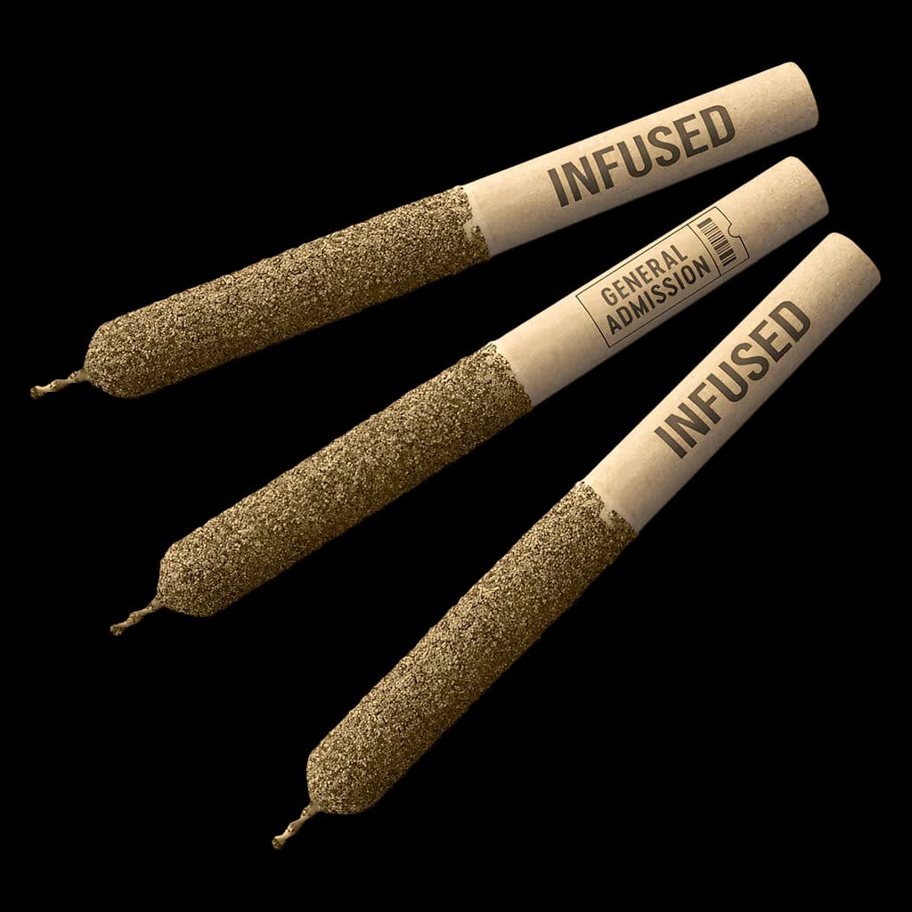 Three General Admission Tiger Blood distillate infused pre-rolls with tan paper wraps and visible kief coating