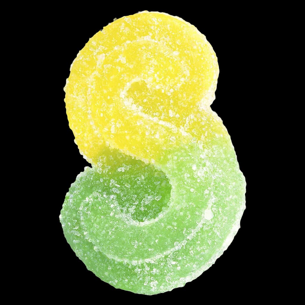 SOURZ by Spinach Mango Lime 1:1 CBC THC soft chews, two sugar-coated gummies in yellow and green