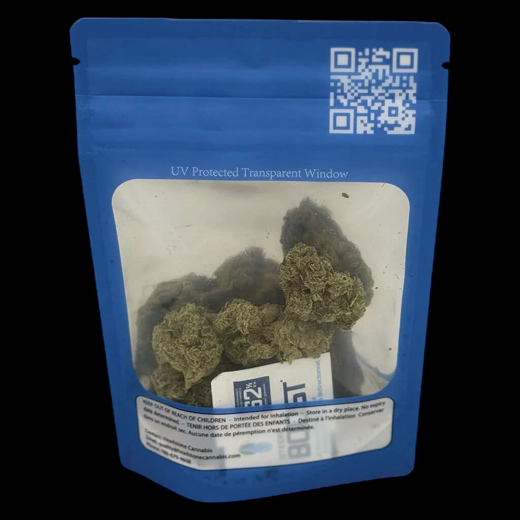 Fleur séchée Sativa Lamb of God de Headstone Cannabis dans une pochette bleue avec fenêtre transparente protégée contre les UV affichant des bourgeons de cannabis