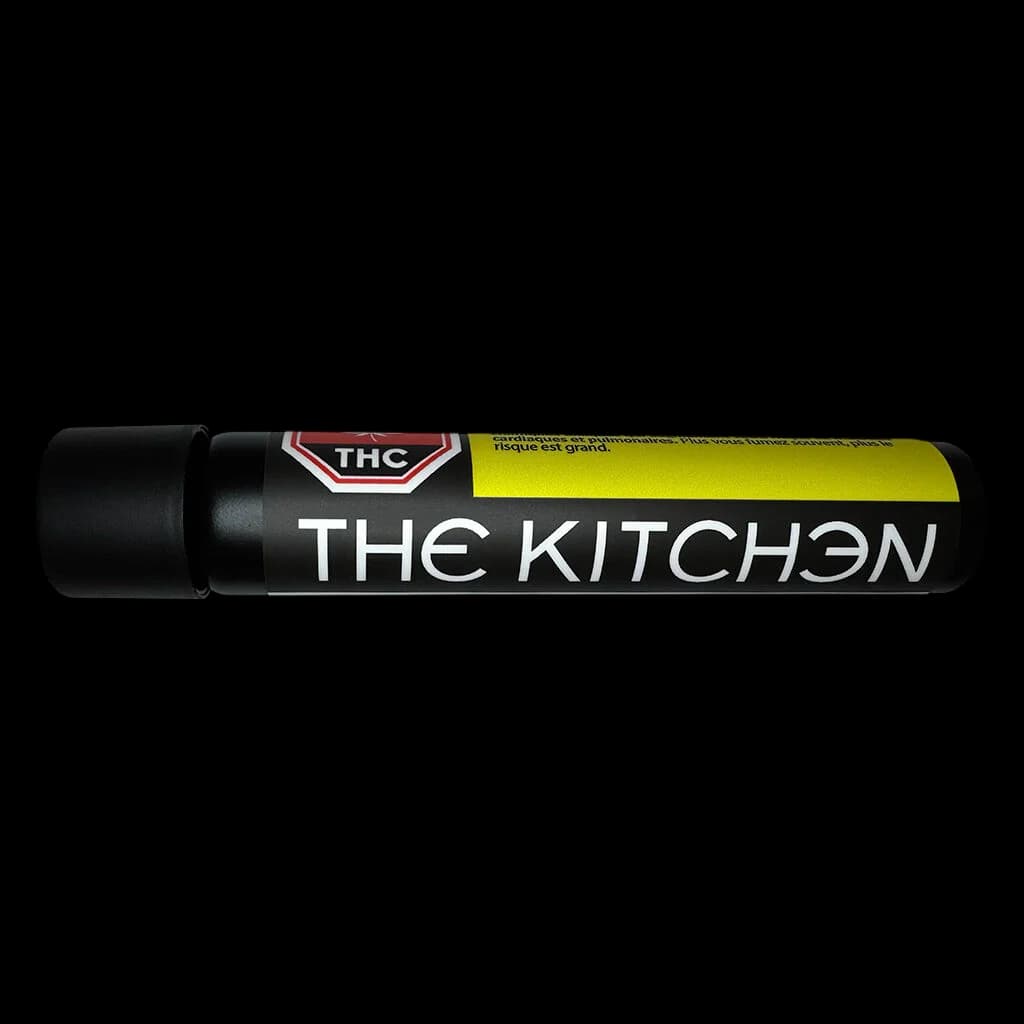 The Kitchen Kadillac Rainbow Blunt pre-roll with black tube packaging, yellow and black label, and THC warning symbol