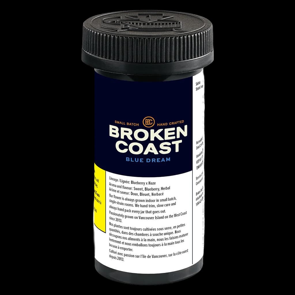 Broken Coast Blue Dream cannabis dried flower in dark glass jar with black child-resistant cap, showing strain lineage and tasting notes on label