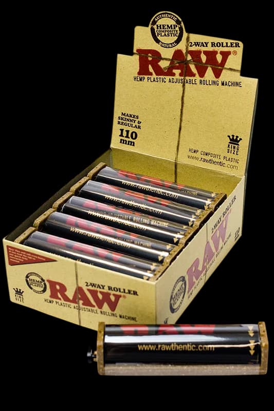 RAW 2-Way Hemp Plastic Roller 79mm display box with 12 rolling machines, showing filled box and single roller unit
