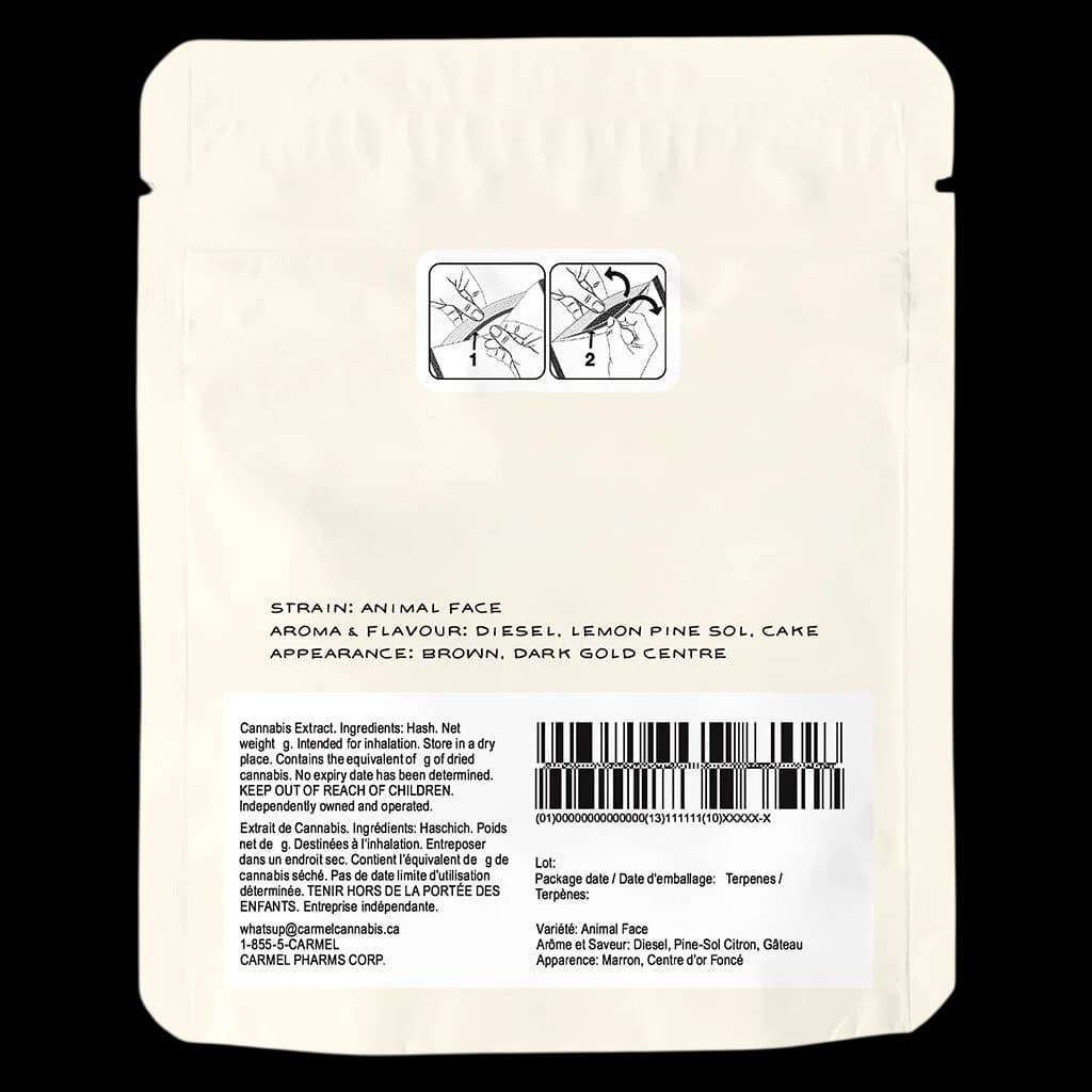 Carmel Animal Face cannabis hash, brown with dark gold centre, rear packaging showing strain profile, ingredients, and regulatory information