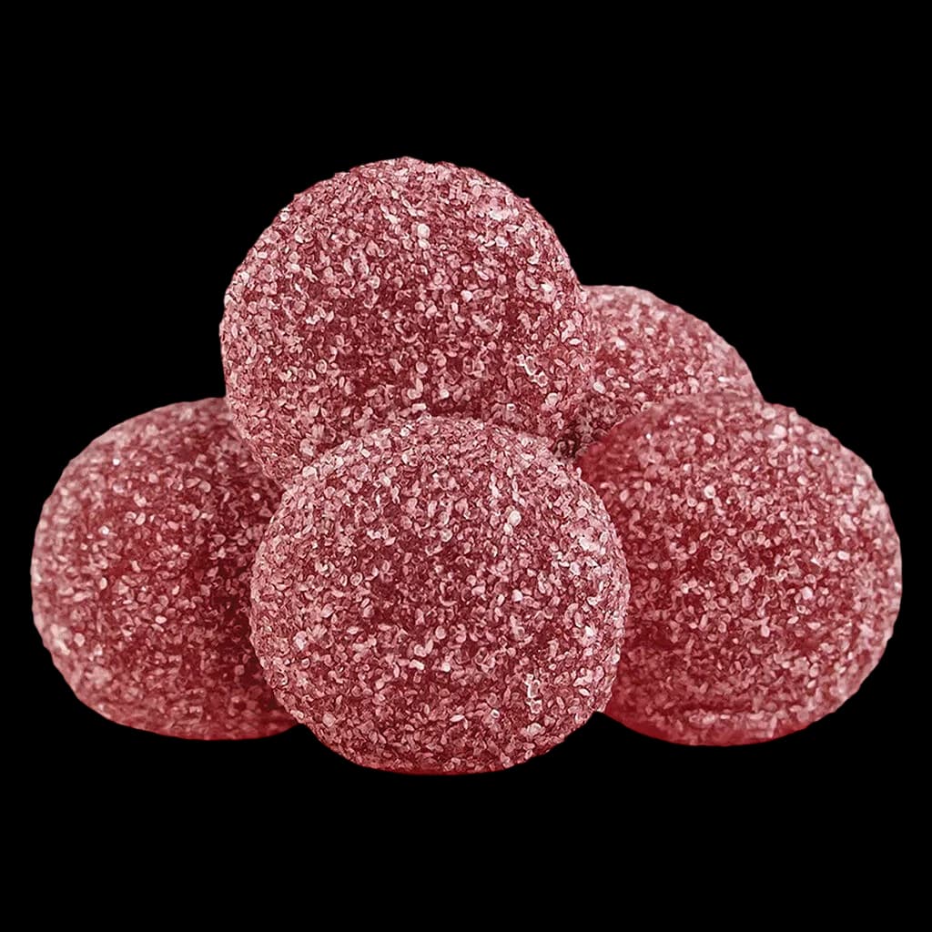 Gommes tendres Pearls by grön Grenade 4:1 CBD/THC, cinq bonbons gélatineux roses enrobés de sucre sur fond blanc