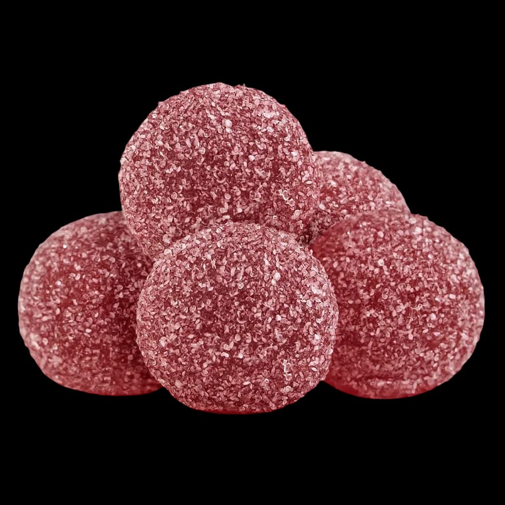 Gommes tendres Pearls by grön Grenade 4:1 CBD/THC, cinq bonbons gélatineux roses enrobés de sucre sur fond blanc