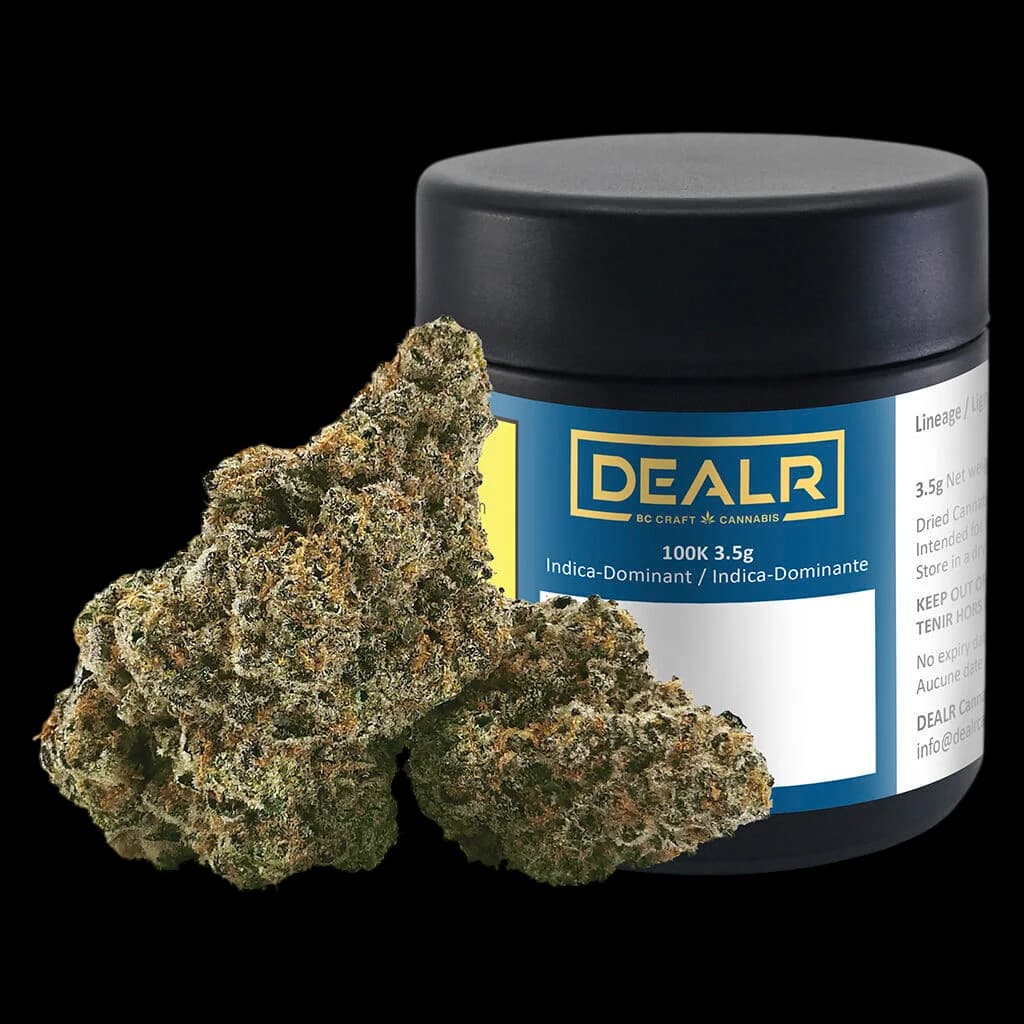 DEALR 100K 3.5g indica-dominant dried flower cannabis with visible buds beside black glass jar packaging