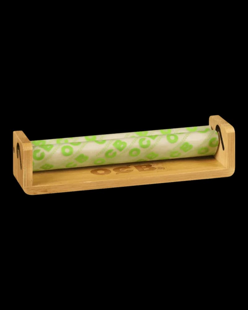 OCB Bamboo Roller Slim 110mm with green leaf-patterned paper roll in natural wood base