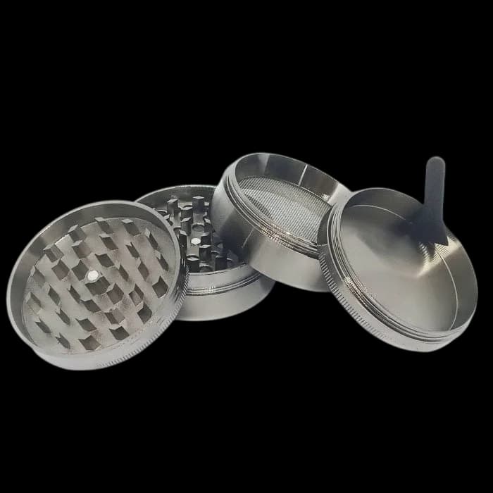 HIT 63mm 4-part metal grinder with grinding chamber, kief screen, and collection compartment displayed open
