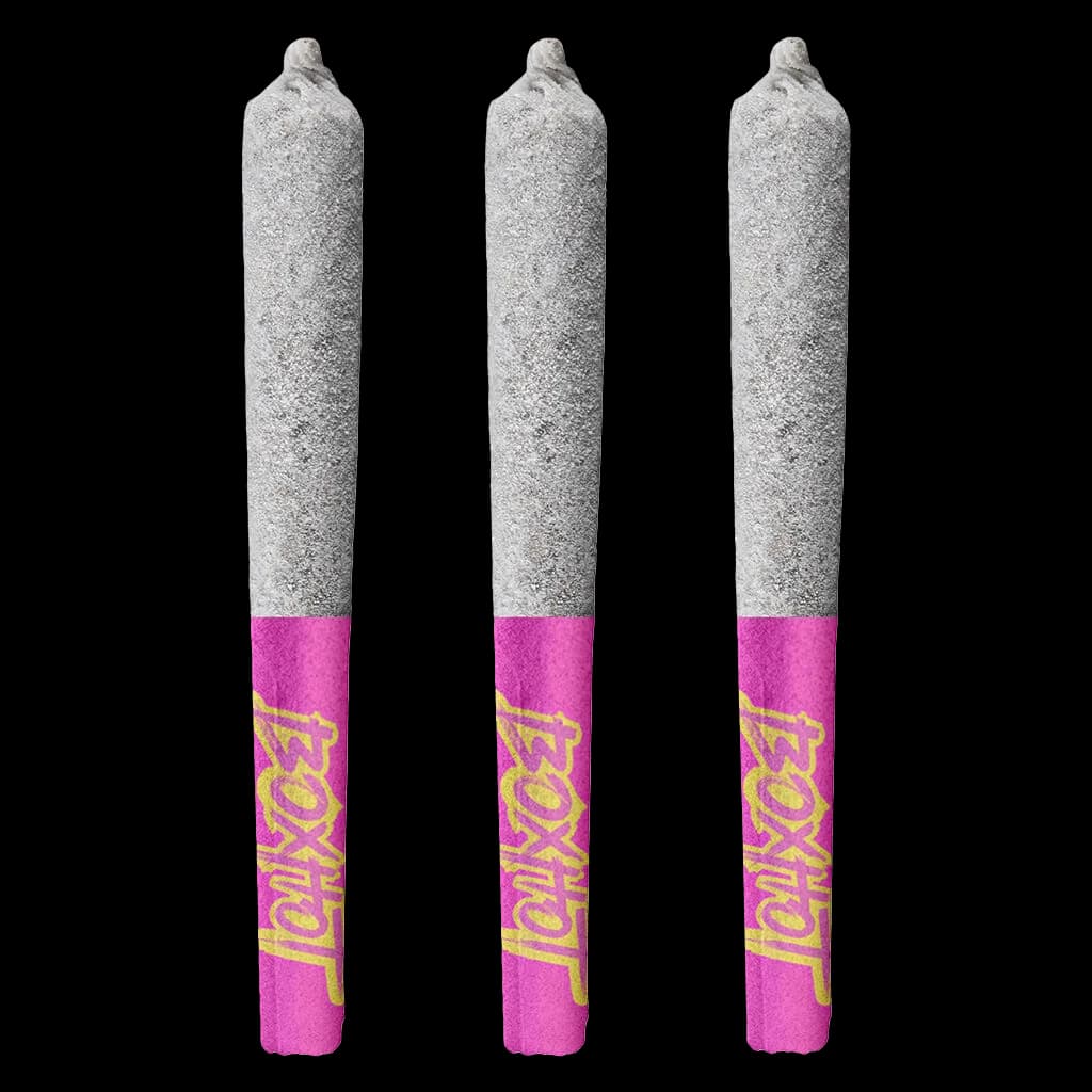 Three BOXHOT Diamond Doobies Deluxe Ruby Rush infused pre-rolls with gray paper and magenta filter bands featuring yellow branding