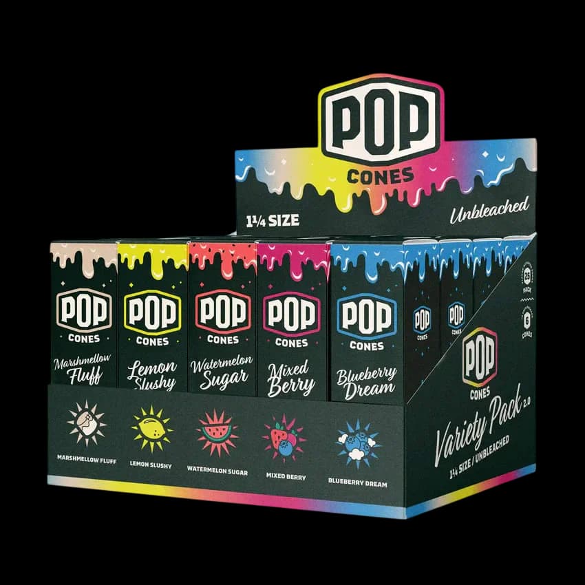 Pop Cones 2.0 unbleached pre-rolled cone variety pack displaying five flavours: Marshmallow Fluff, Lemon Slushy, Watermelon Sugar, Mixed Berry, and Blueberry Dream, 1¼ size, 6-pack box.