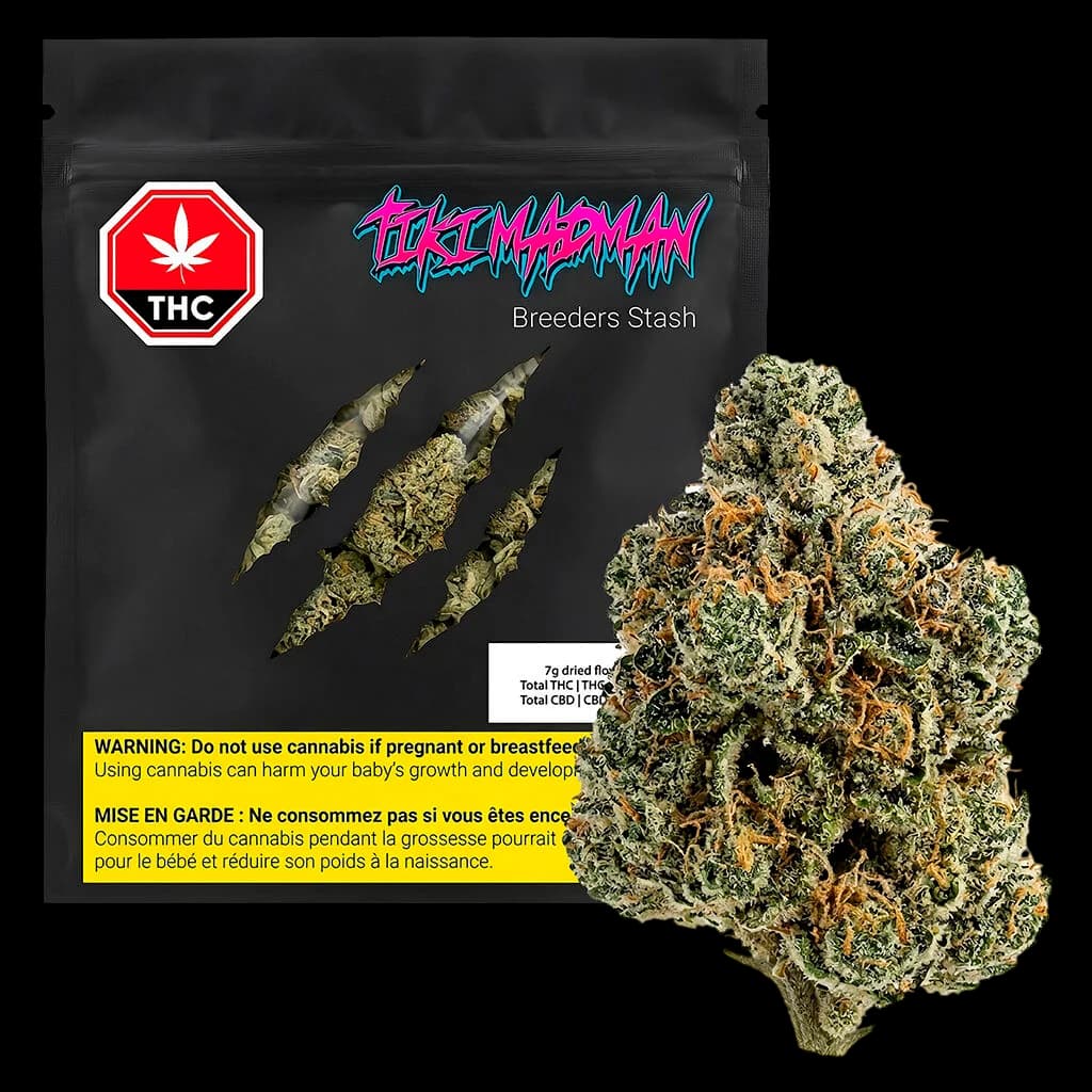 Tiki Madman Breeders Stash 7g dried flower cannabis buds with green and orange hues next to black pouch packaging