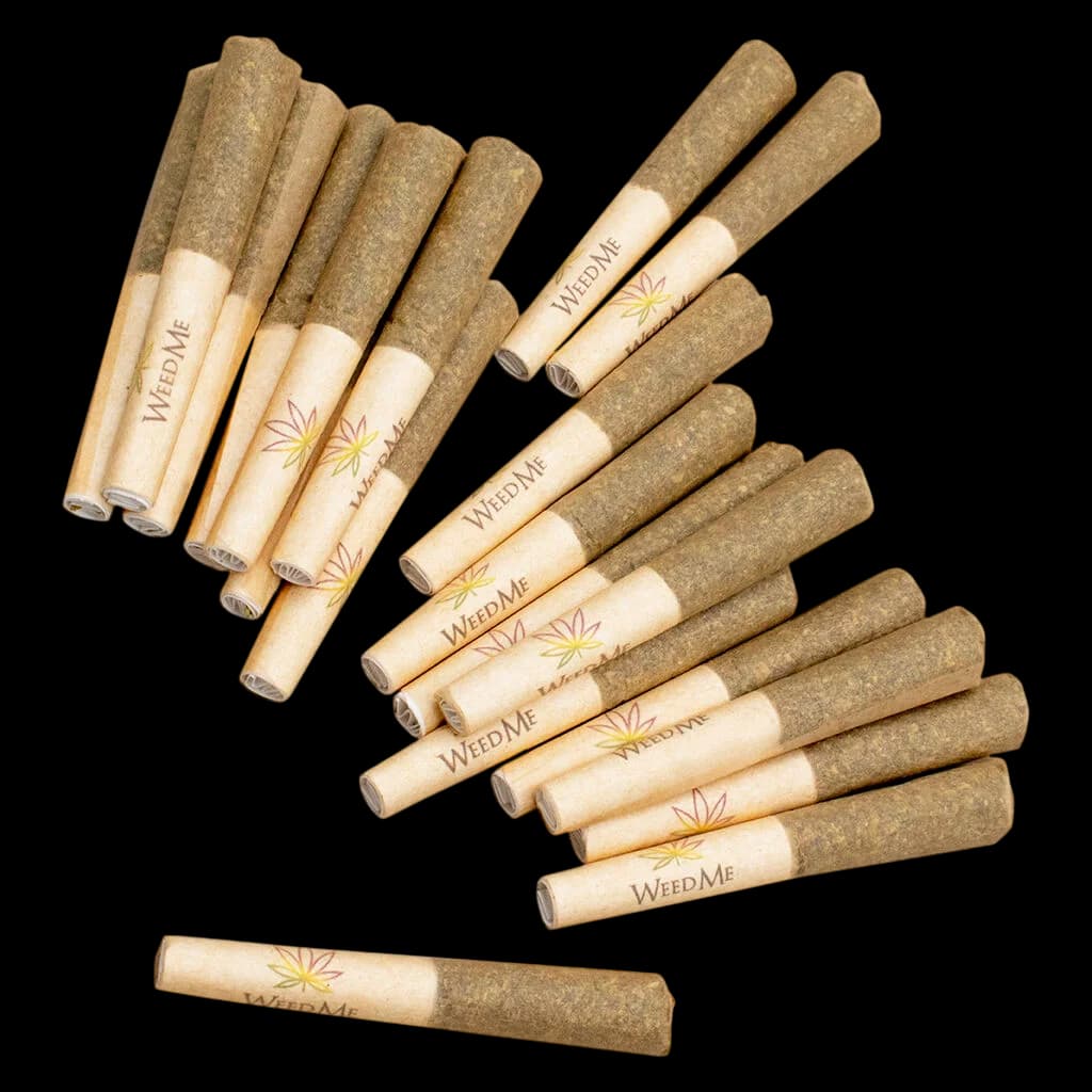 Weed Me Grind Indica 420 pre-roll pack with 14 cannabis pre-rolls displayed, tan paper wrapping with branded label and leaf logo