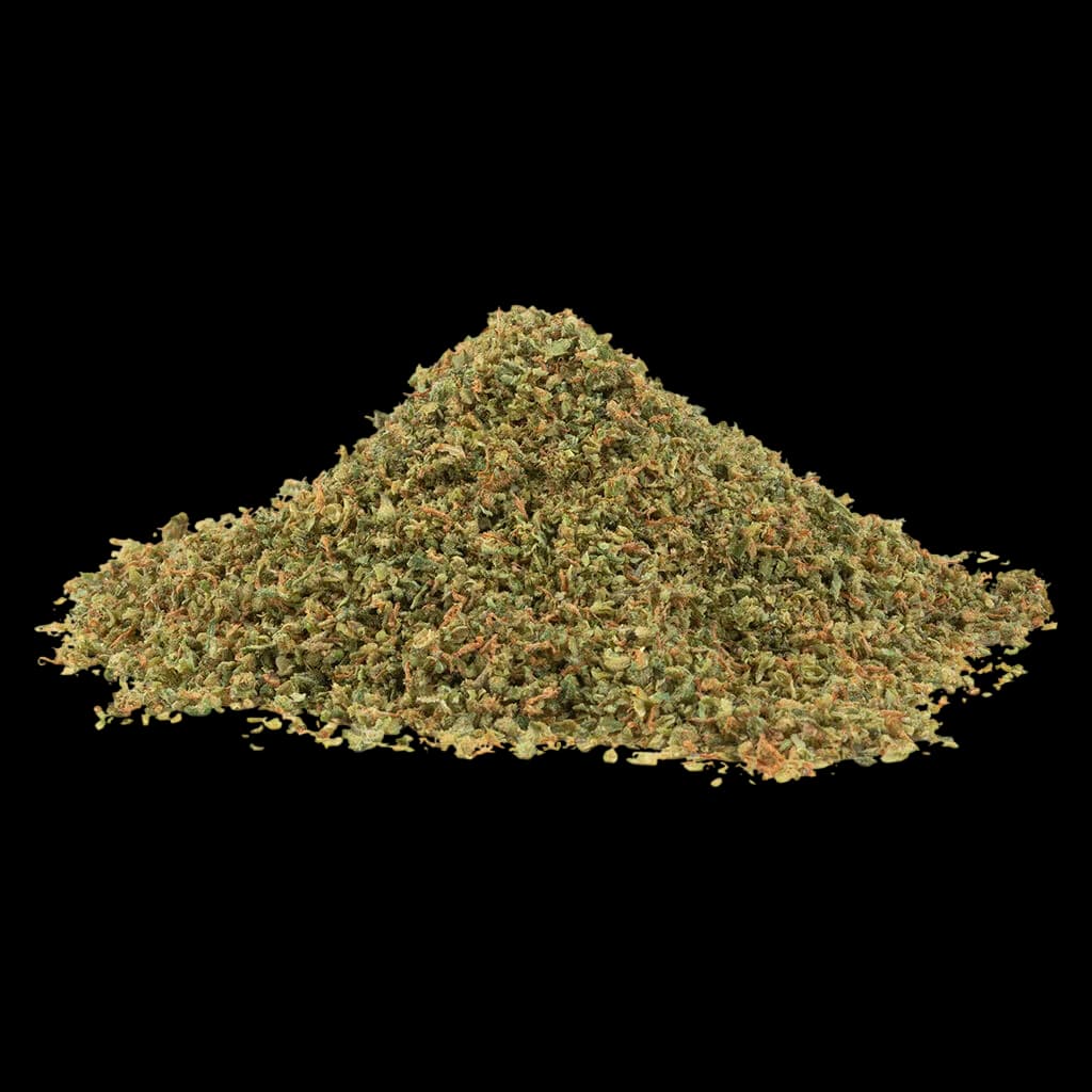 Fleurs de cannabis séchées SHRED Tropic Thunder, tas en vrac montrant de la matière florale verte et beige