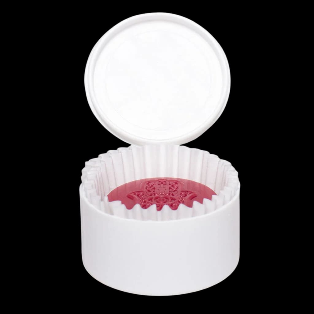 Rosin Heads Hash Rosin Peanut Butter Cup in Raspberry, pink-colored cannabis edible in white container with lid