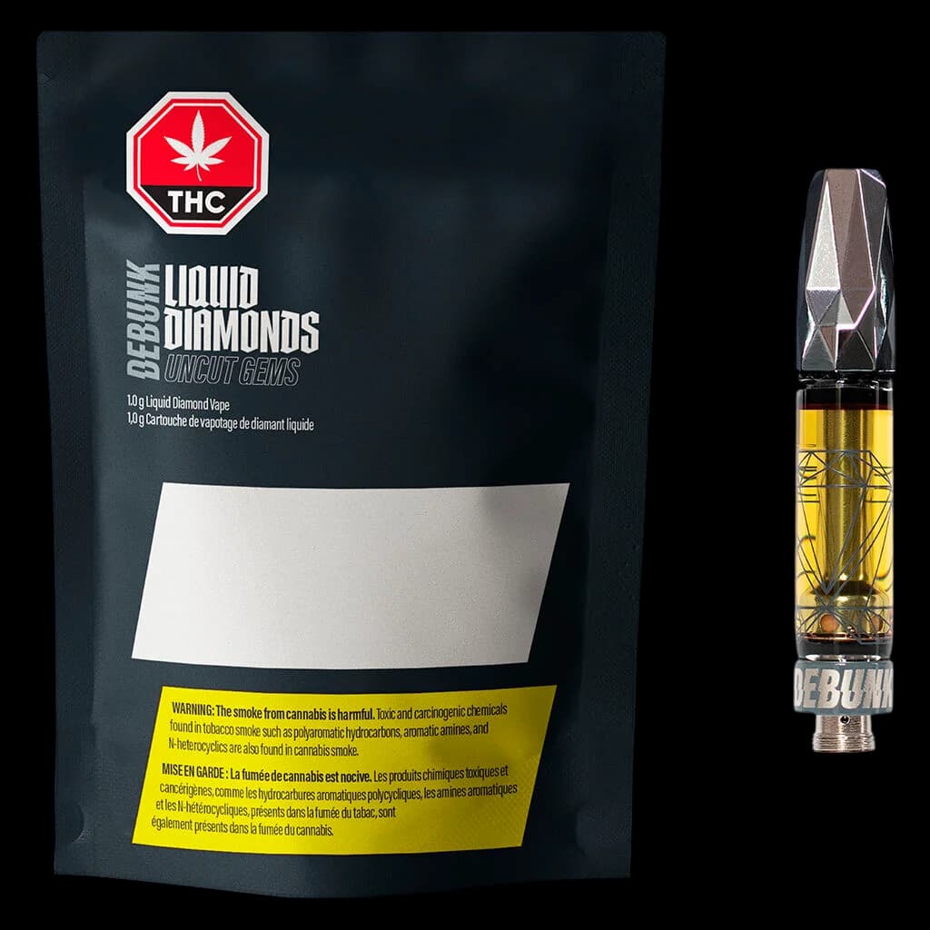 Debunk Uncut Gems Liquid Diamond 510 thread vape cartridge with gold distillate and geometric black mouthpiece, displayed with front packaging