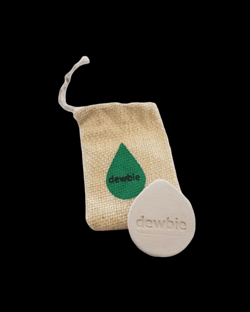 Dewbie humidity stone with natural linen pouch, teardrop-shaped ceramic insert embossed with brand name