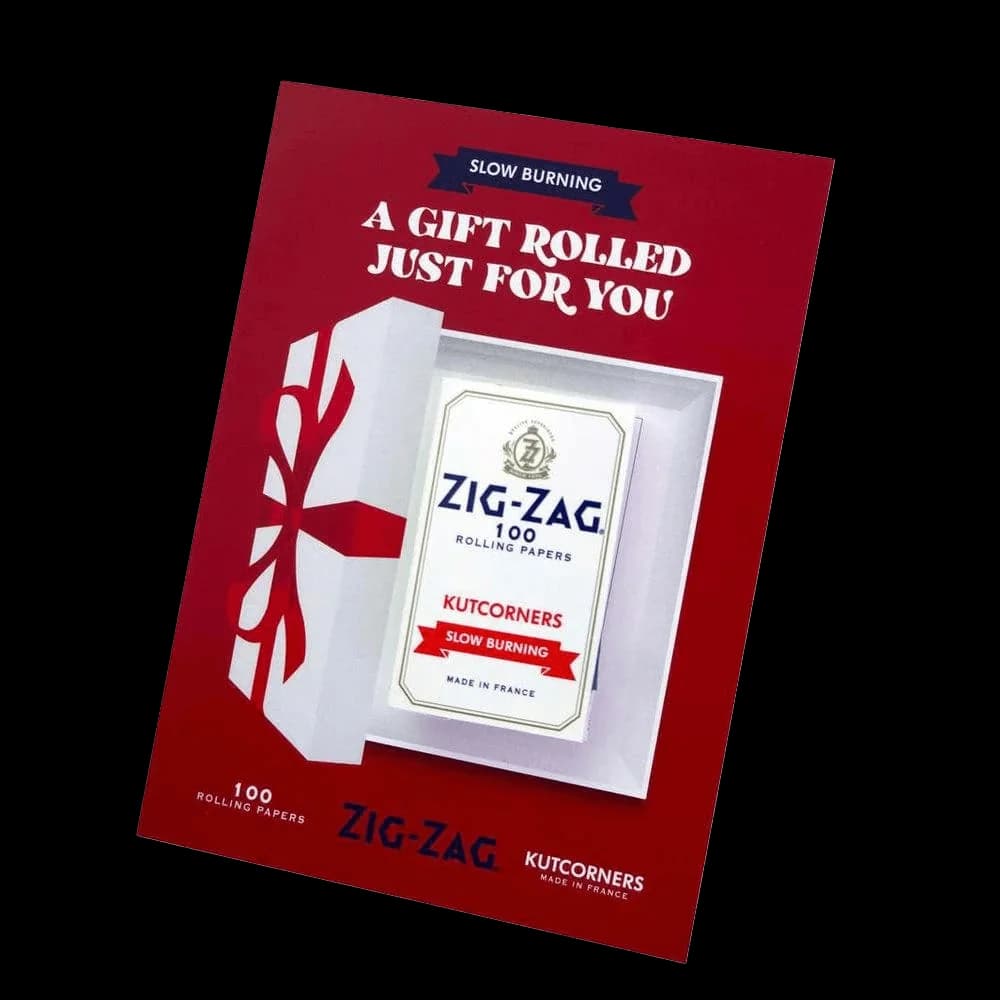 Zig-Zag 100 rolling papers with Kutcorners slow burning feature, packaged in red gift box