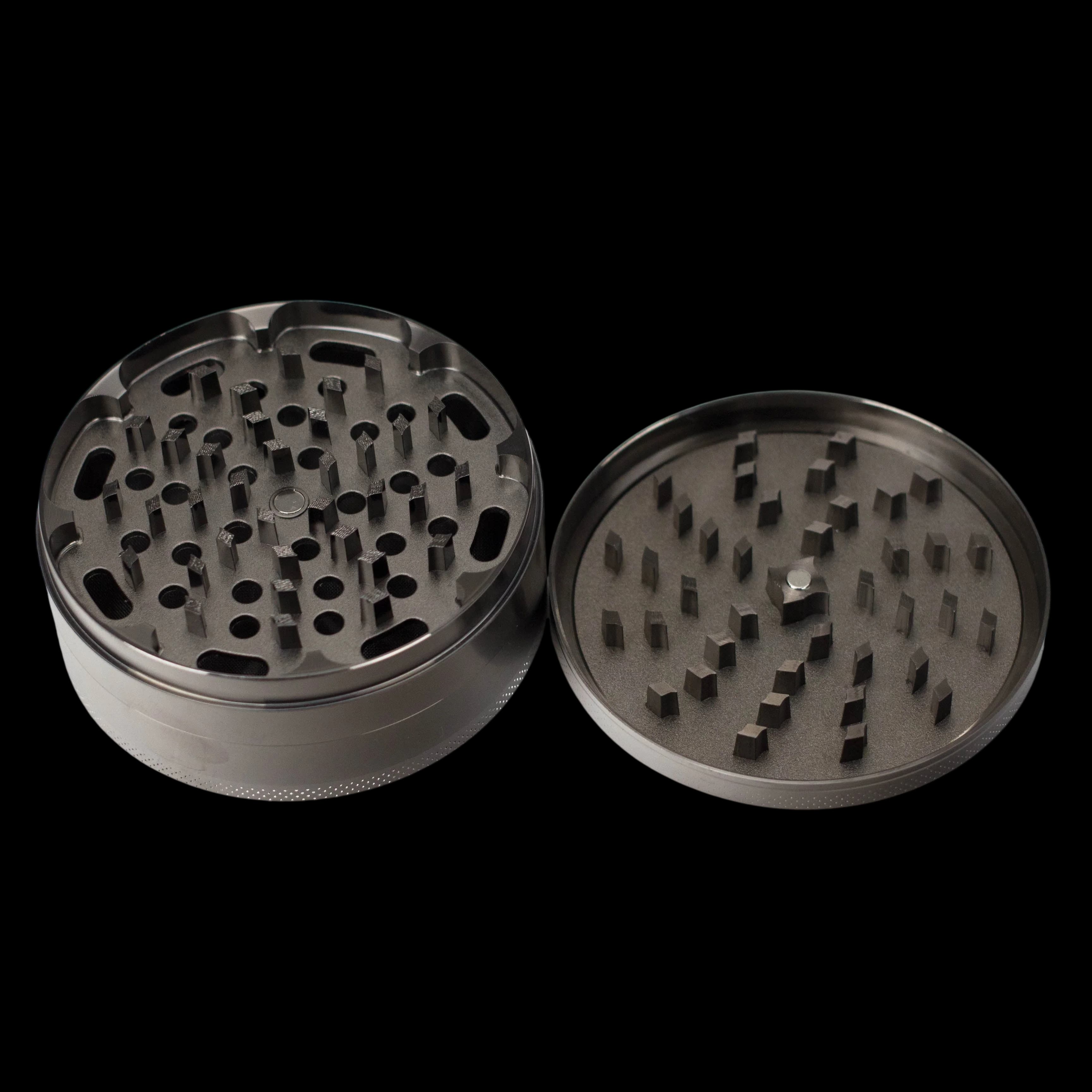 NIBO Distribution Zinc Gun Metal HIT Grinder 100mm 4-piece, showing top and bottom chambers with grinding teeth and kief screen