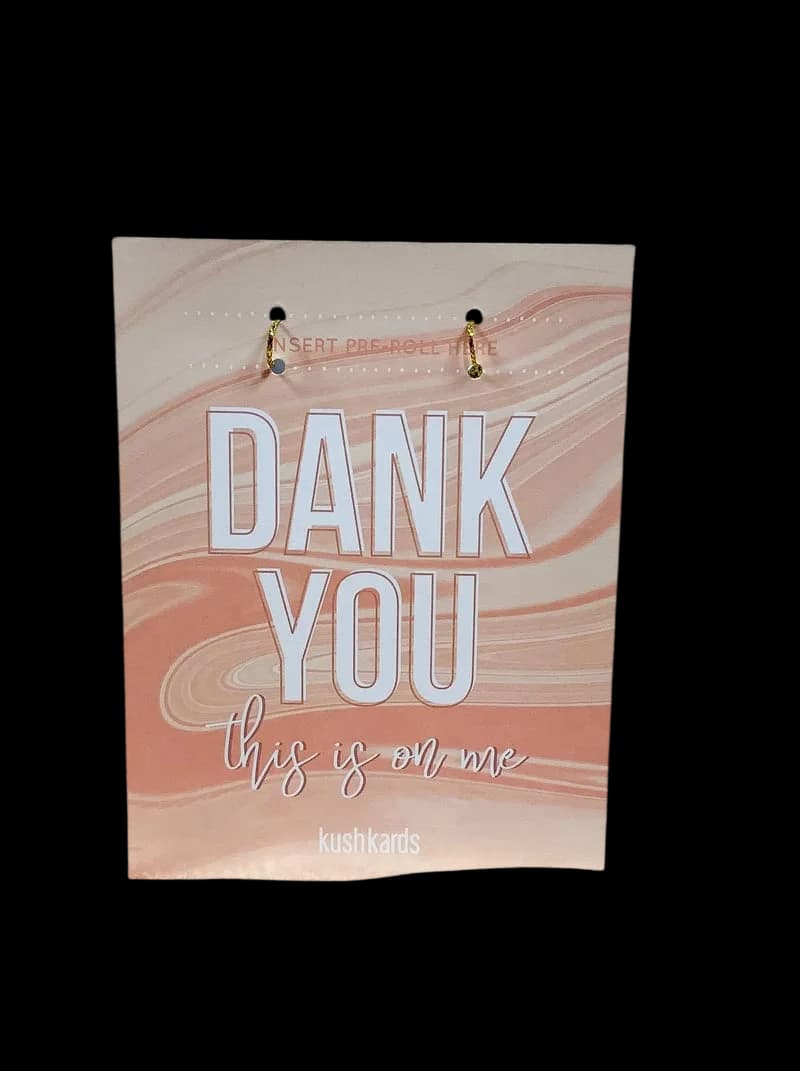 KushKards 'Dank You' greeting card with marbled peach and cream design, text reads 'DANK YOU this is on me' with two pre-roll slots at top